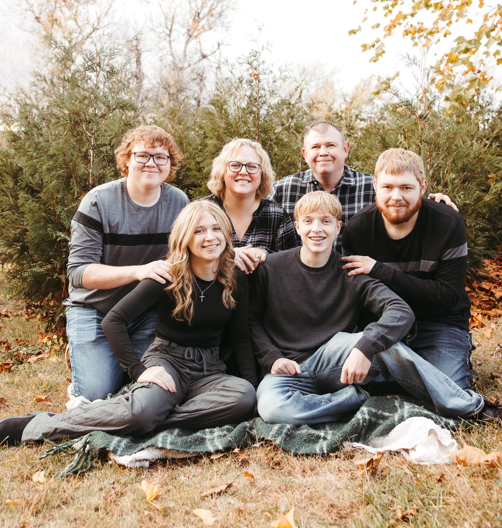 Amanda Seiler - employee at Virginia Gay Hospital VGH, family all wearing black smiling posing